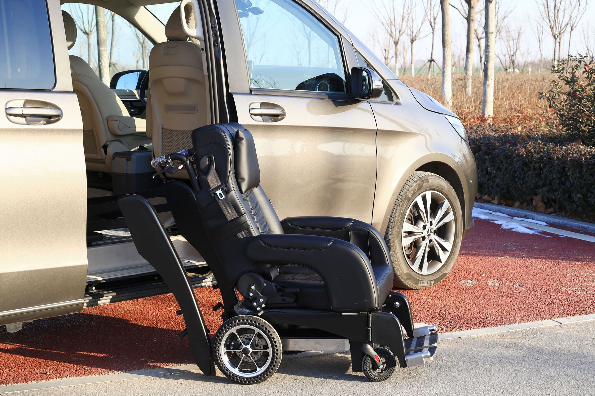 A modern van with an open sliding door showcasing a wheelchair, emphasizing accessibility and convenience.